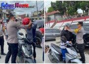 Polres Taput Bagikan Helm Pada Pengendara